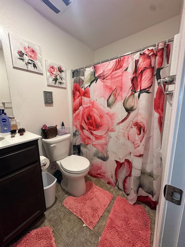 628 Marcus Ave, Merced, CA 95341 - bathroom with vanity, toilet, tile patterned floors, a shower with curtain, and visible vents