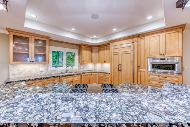 1409 W Big Sandy Rd, Fresno, CA 93711 - kitchen featuring oven, a tray ceiling, decorative backsplash, and a sink