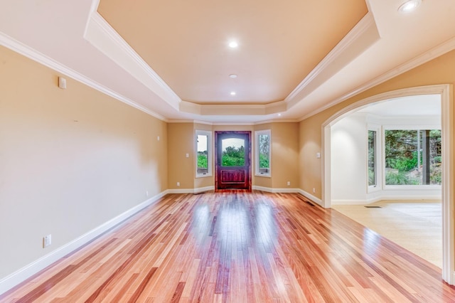 1409 W Big Sandy Rd, Fresno, CA 93711 - foyer entrance with crown molding, arched walkways, baseboards, light wood-type flooring, and a tray ceiling