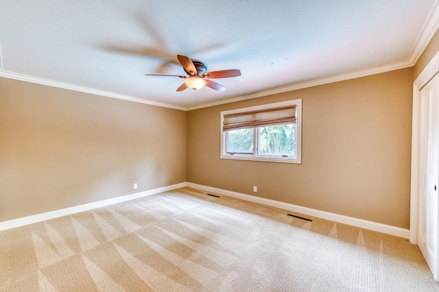 1409 W Big Sandy Rd, Fresno, CA 93711 - spare room featuring ceiling fan, light colored carpet, ornamental molding, and baseboards
