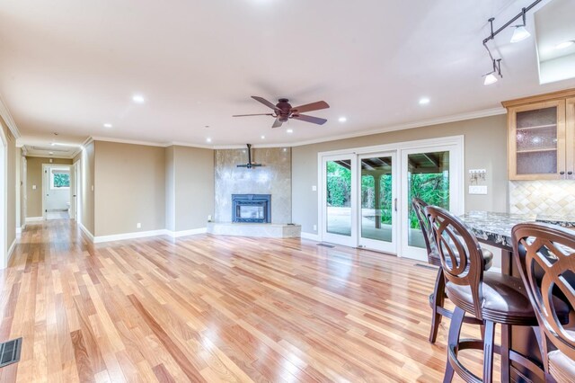 1409 W Big Sandy Rd, Fresno, CA 93711 - living room with a ceiling fan, light wood-style flooring, and ornamental molding