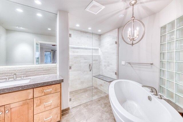 1409 W Big Sandy Rd, Fresno, CA 93711 - full bathroom with vanity, a shower stall, recessed lighting, and a tub to relax in