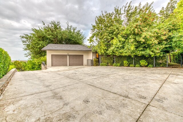 1409 W Big Sandy Rd, Fresno, CA 93711 - detached garage with fence and central AC unit