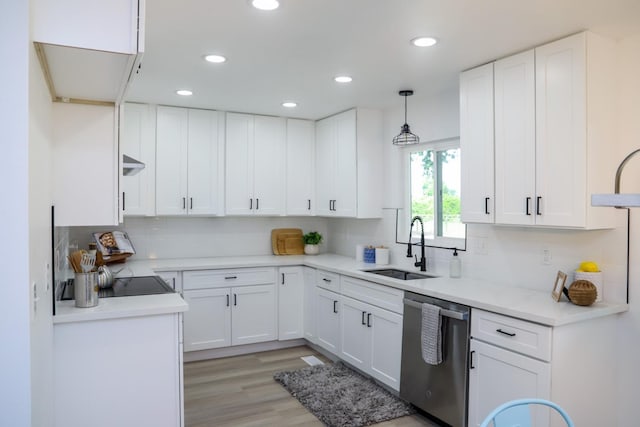 kitchen featuring a sink, white cabinetry, recessed lighting, backsplash, and stainless steel dishwasher