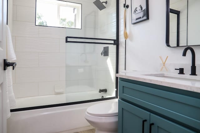 bathroom featuring vanity, shower / bathtub combination, and toilet