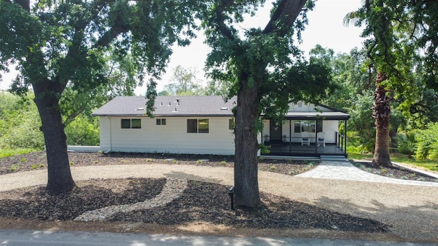 back of house with covered porch
