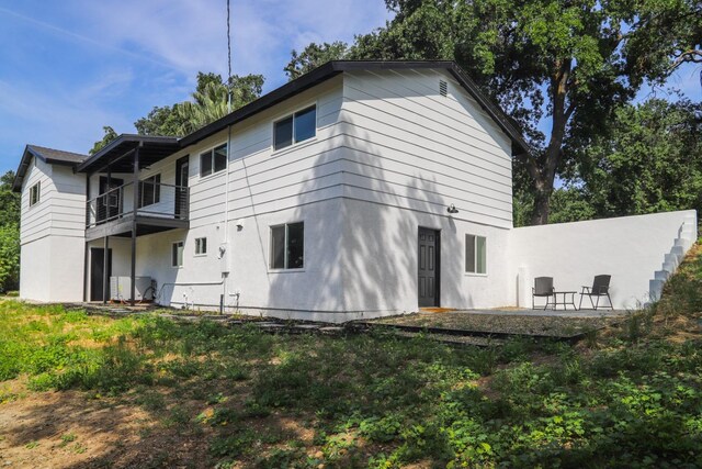 17231 E Trimmer Springs Rd, Sanger, CA 93657 - back of house with a balcony and stucco siding