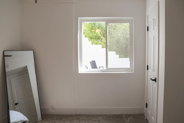 interior space featuring baseboards