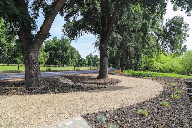 17231 E Trimmer Springs Rd, Sanger, CA 93657 - view of property's community featuring curved driveway and fence