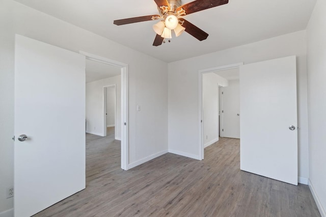 2521 E Washington Ave, Fresno, CA 93701 - spare room featuring light wood-style flooring and a ceiling fan