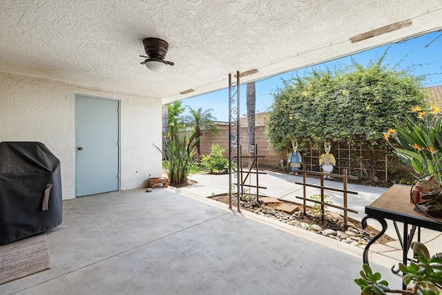 view of patio / terrace featuring a fenced backyard, ceiling fan, and area for grilling