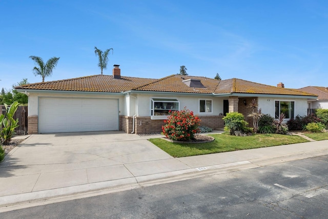 ranch-style home featuring a garage, stucco siding, a tiled roof, and a chimney