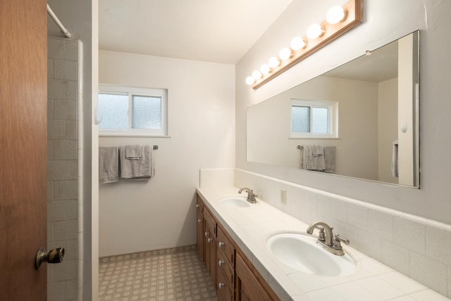 6352 N Fisher St, Fresno, CA 93710 - full bath featuring tile patterned floors, plenty of natural light, double vanity, and decorative backsplash