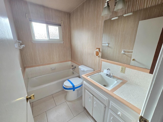 full bath featuring toilet, tile patterned floors, shower / tub combination, and vanity