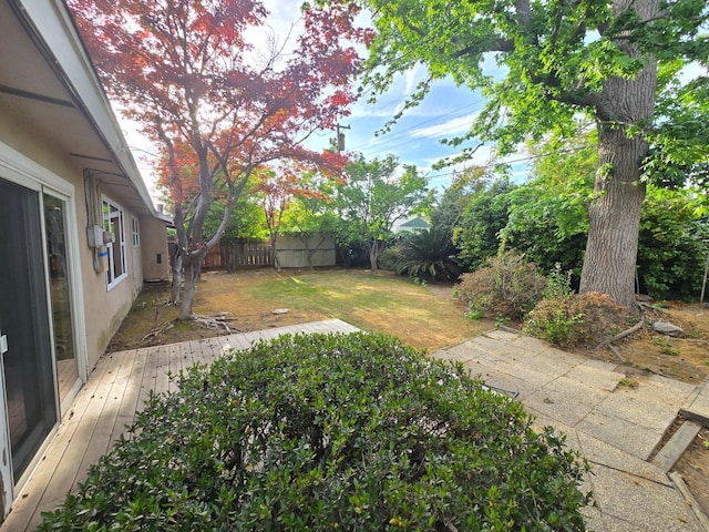 view of yard featuring a fenced backyard and a wooden deck