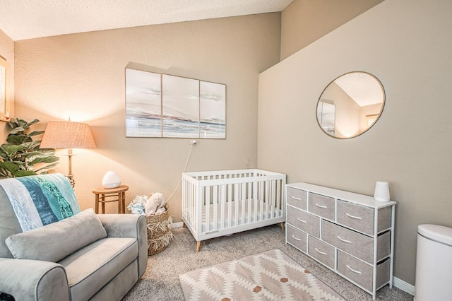 bedroom with carpet floors, baseboards, and lofted ceiling