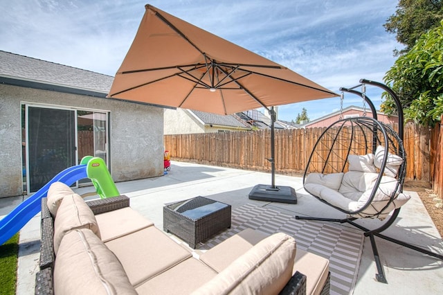 view of patio / terrace featuring an outdoor living space and a fenced backyard