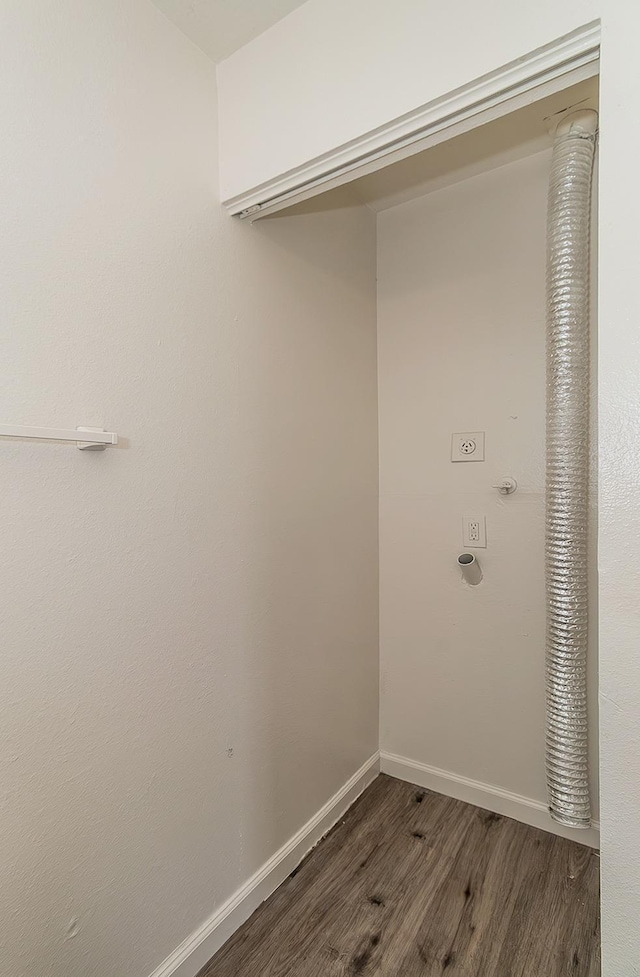 washroom with baseboards, hookup for an electric dryer, laundry area, and wood finished floors