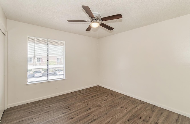 1221 N Peach Ave Unit 226, Fresno, CA 93727 - spare room with baseboards, a ceiling fan, a textured ceiling, and wood finished floors