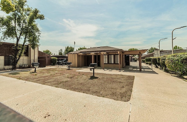 1221 N Peach Ave Unit 226, Fresno, CA 93727 - view of front of house featuring a patio and fence
