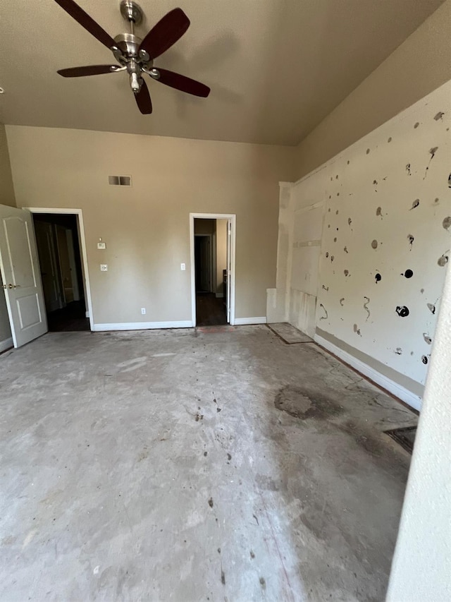 empty room featuring baseboards, ceiling fan, concrete flooring, and visible vents