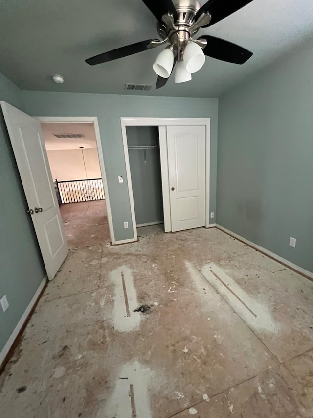 unfurnished bedroom with visible vents, baseboards, and a closet
