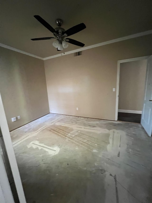 spare room with crown molding and a ceiling fan