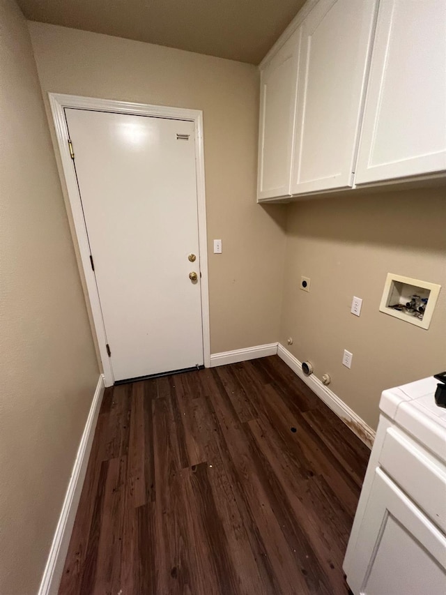 laundry area featuring baseboards, dark wood-type flooring, cabinet space, washer hookup, and hookup for an electric dryer