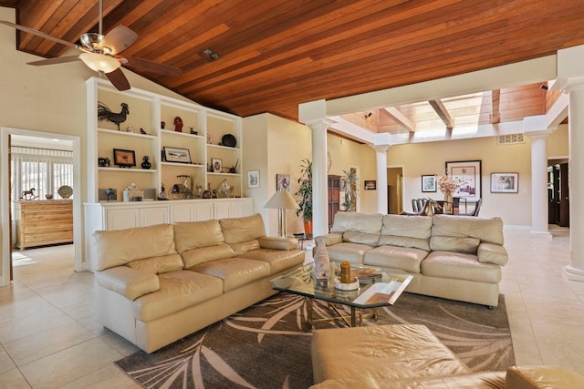 living room featuring light tile patterned flooring, ceiling fan, ornate columns, wooden ceiling, and lofted ceiling with beams