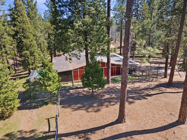 view of yard featuring an outdoor structure and an outbuilding