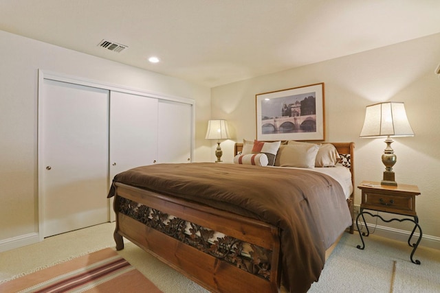 bedroom with visible vents, a closet, baseboards, recessed lighting, and carpet