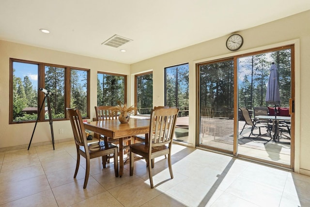 sunroom featuring recessed lighting, baseboards, tile patterned floors, and visible vents
