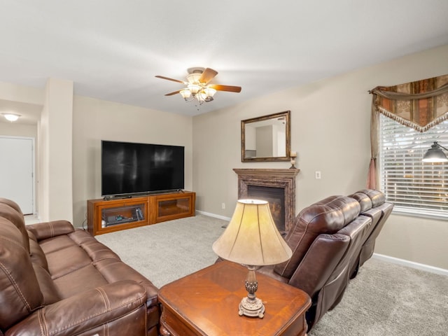 9596 N Winery Ave, Fresno, CA 93720 - living area with carpet floors, a ceiling fan, baseboards, and a glass covered fireplace