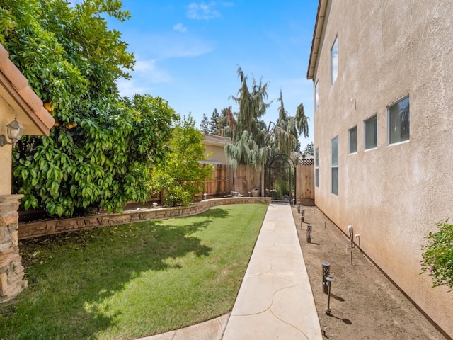 9596 N Winery Ave, Fresno, CA 93720 - view of yard featuring fence and a gate