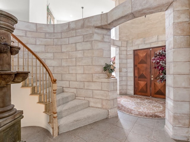 9596 N Winery Ave, Fresno, CA 93720 - stairway with tile walls and tile patterned flooring