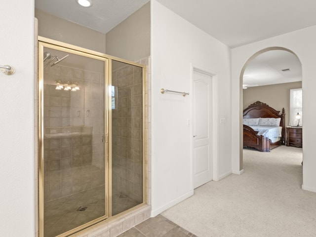 9596 N Winery Ave, Fresno, CA 93720 - ensuite bathroom featuring baseboards, a stall shower, and ensuite bath