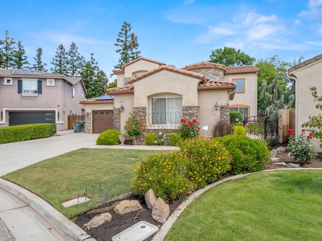 9596 N Winery Ave, Fresno, CA 93720 - mediterranean / spanish-style home with stucco siding, driveway, and stone siding