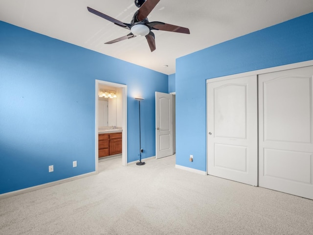 9596 N Winery Ave, Fresno, CA 93720 - unfurnished bedroom with ceiling fan, carpet floors, baseboards, ensuite bathroom, and a closet
