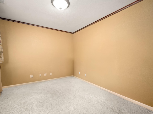 9596 N Winery Ave, Fresno, CA 93720 - carpeted spare room featuring crown molding and baseboards