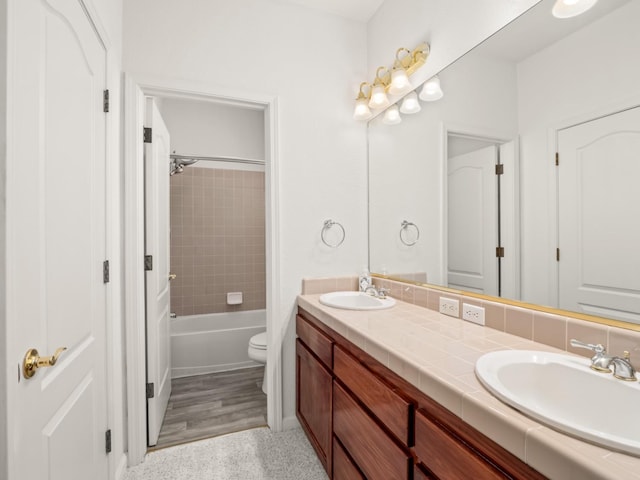 9596 N Winery Ave, Fresno, CA 93720 - full bath with double vanity, toilet, shower / tub combination, and a sink