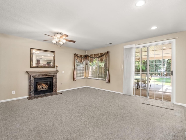 9596 N Winery Ave, Fresno, CA 93720 - unfurnished living room featuring ceiling fan, a fireplace, carpet floors, recessed lighting, and baseboards