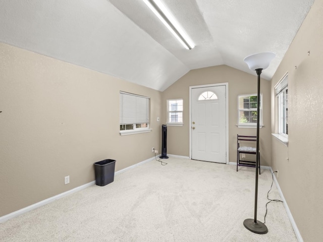 9596 N Winery Ave, Fresno, CA 93720 - entryway featuring baseboards, carpet flooring, a textured ceiling, and lofted ceiling