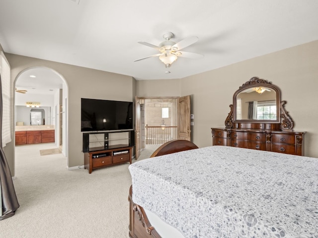 9596 N Winery Ave, Fresno, CA 93720 - bedroom featuring arched walkways, a ceiling fan, light carpet, and multiple windows