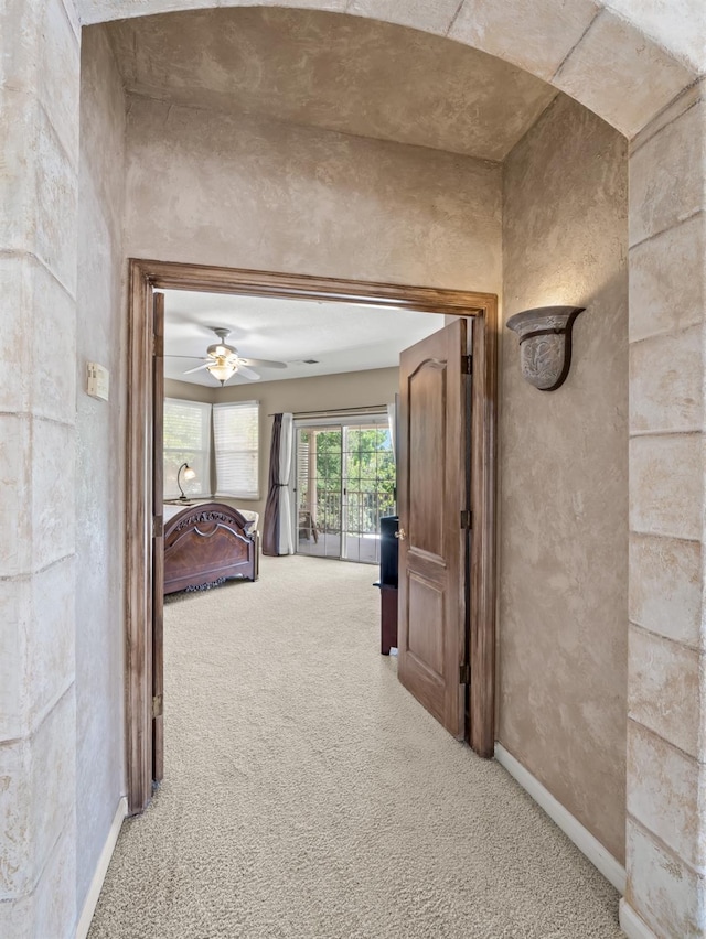 9596 N Winery Ave, Fresno, CA 93720 - hallway featuring baseboards and light carpet
