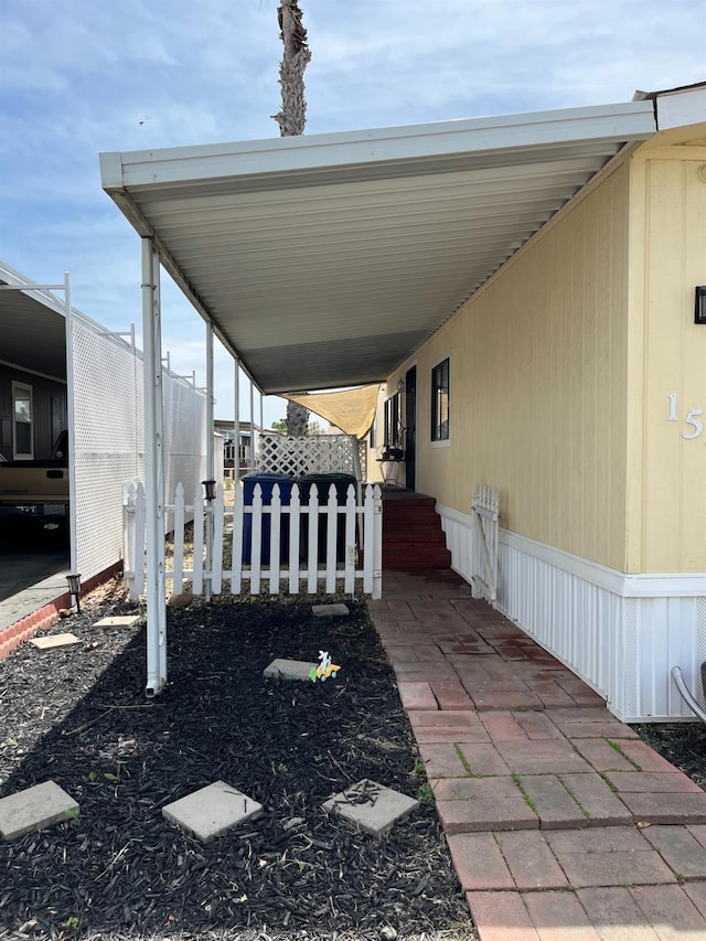 860 E Grangeville Blvd Unit 153, Hanford, CA 93230 - view of patio / terrace with a carport