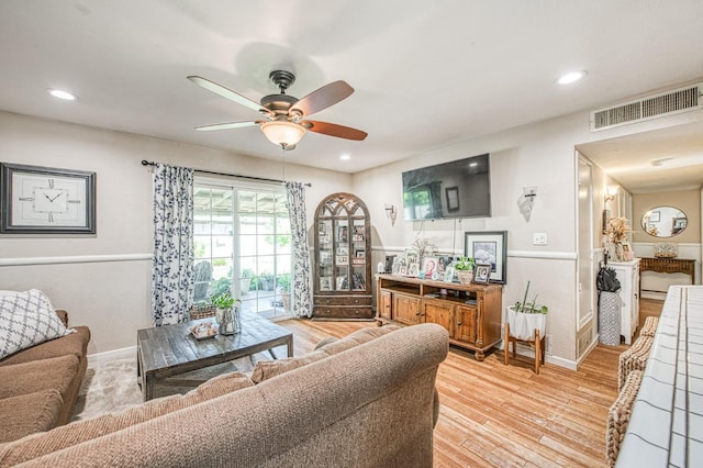 living area with a ceiling fan, baseboards, recessed lighting, light wood-type flooring, and visible vents