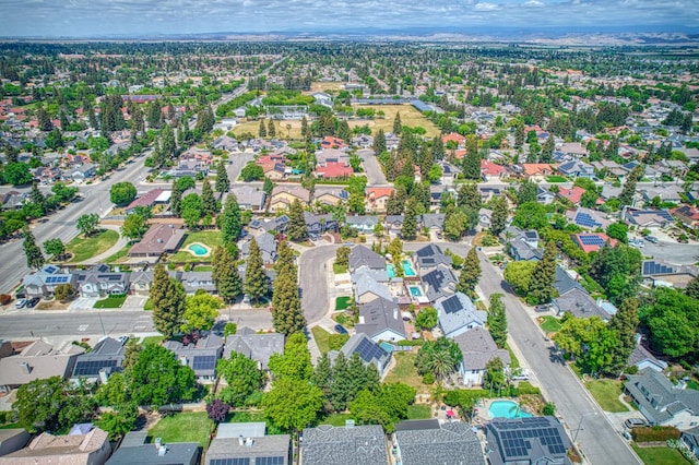birds eye view of property with a residential view