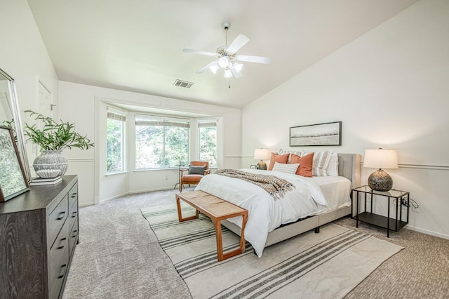 bedroom with baseboards, light carpet, lofted ceiling, and visible vents