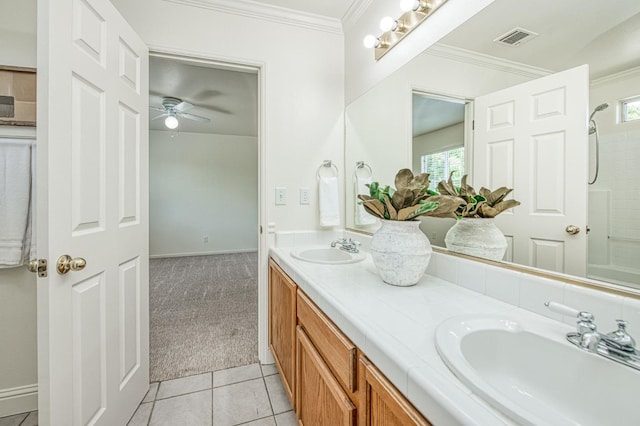 bathroom with visible vents, ornamental molding, and a sink