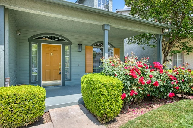 doorway to property featuring a porch